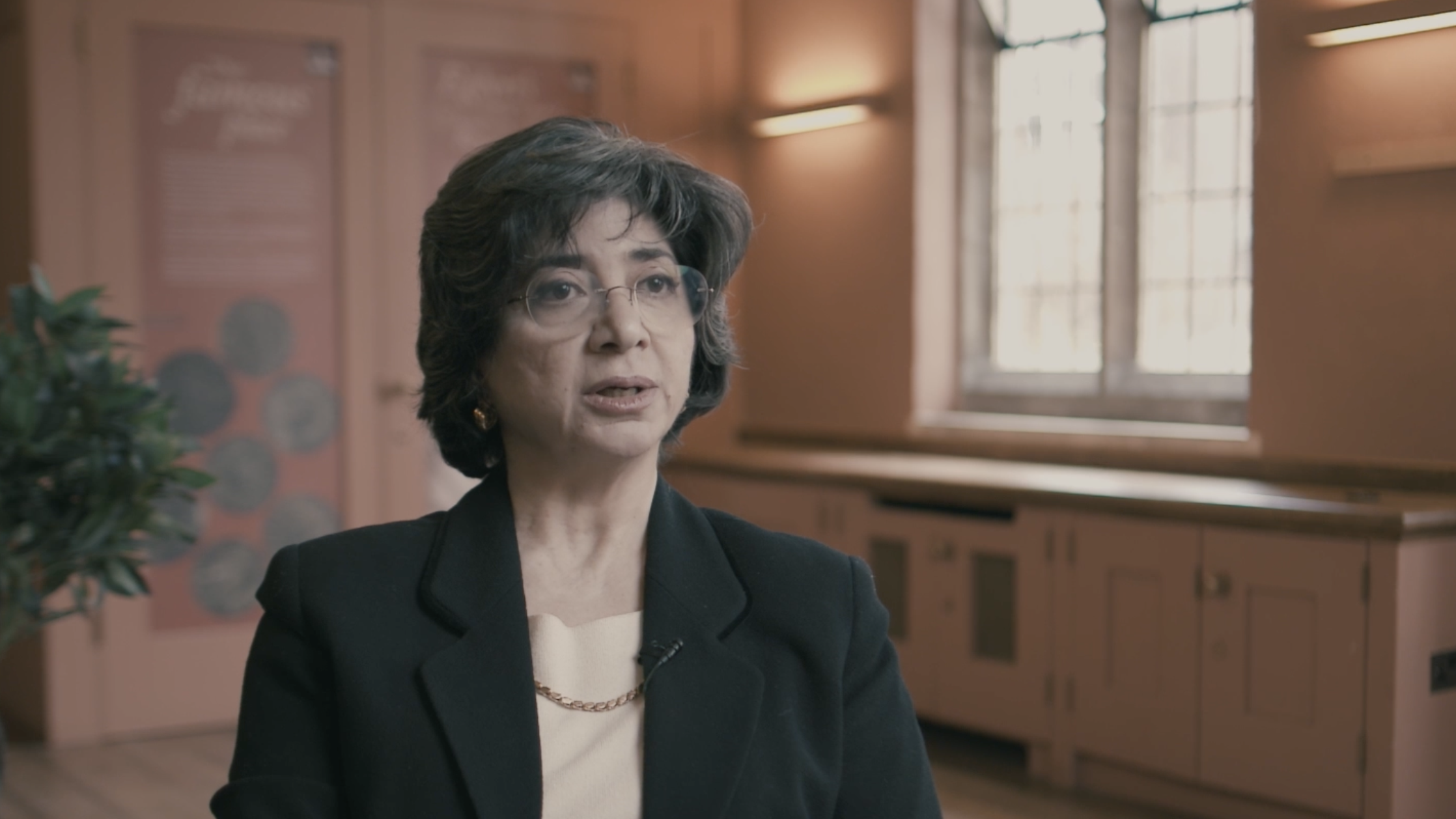 A woman gives testimony in an interview setting